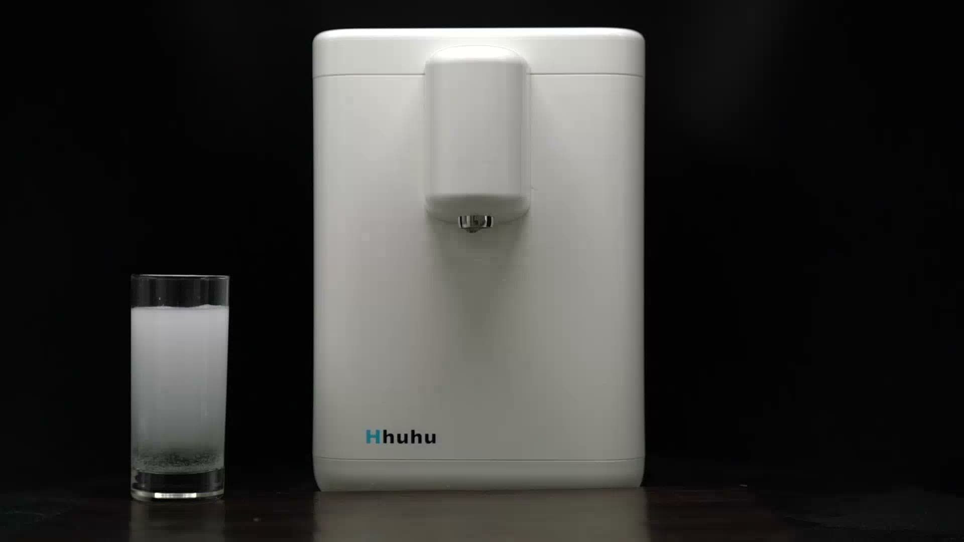 Hhuhu Hydrogen Milker beside a glass of freshly dispensed hydrogen water